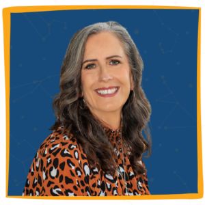 A woman with long hair and leopard print shirt.